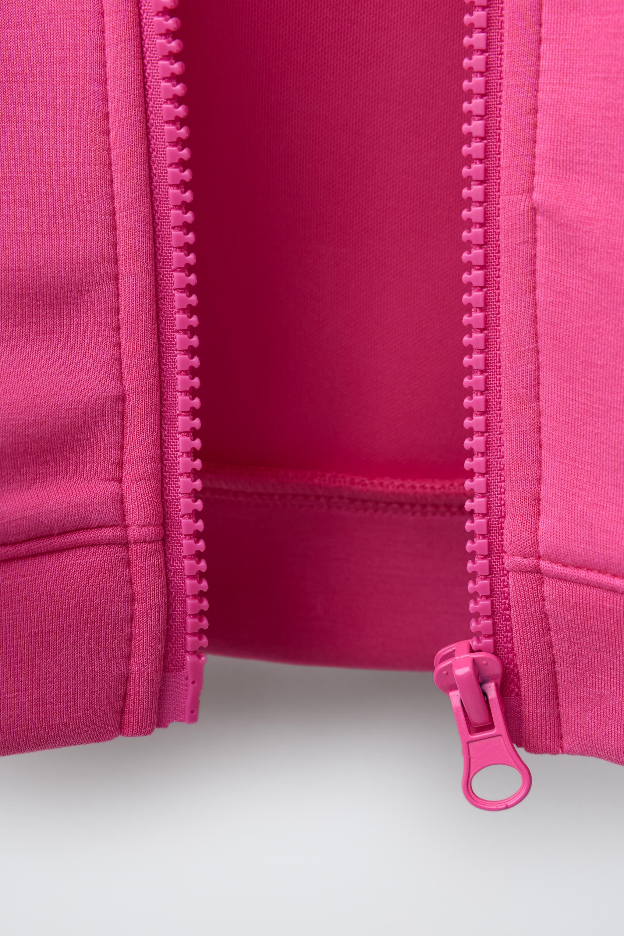 SWEAT ZIPPÉ À INSCRIPTION EN RELIEF SPORT